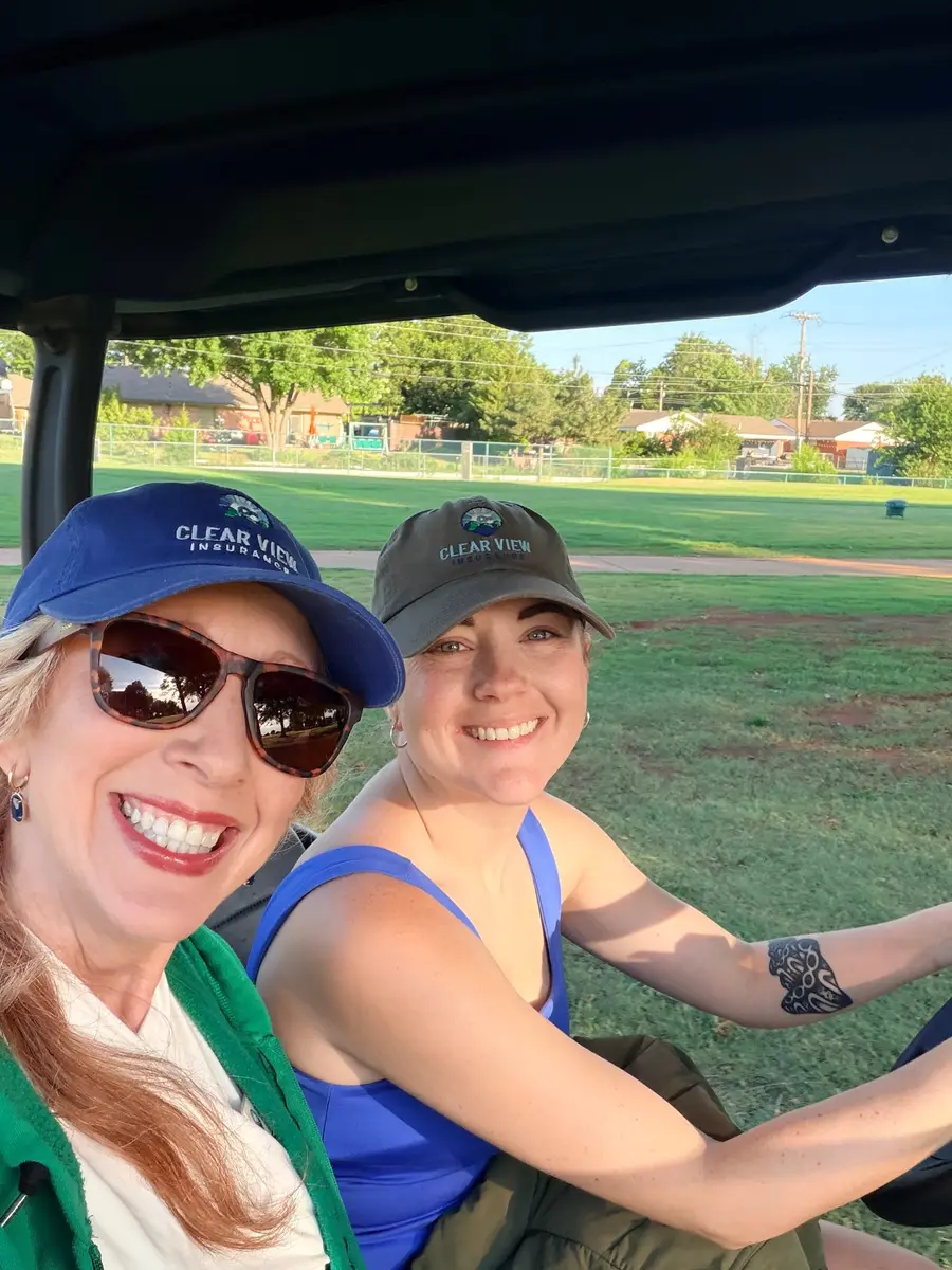 Baylie and Heather in Clear View caps, working a golf tournament